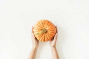 hands holding pumpkin