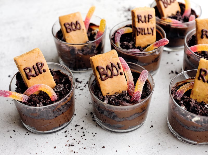 Chocolate Avocado Mousse Tombstone Dirt Cups with tombstone and candy worms