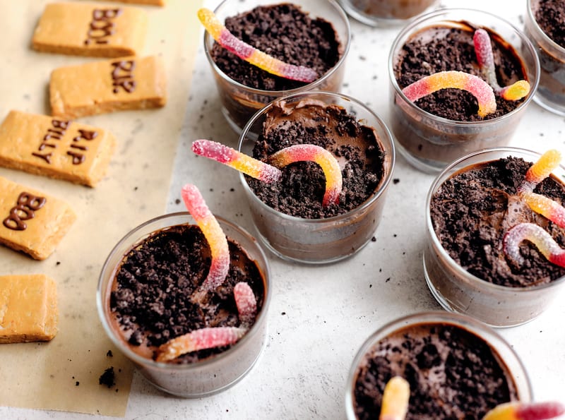 Avocado chocolate mousse dirt cups with candy worms 